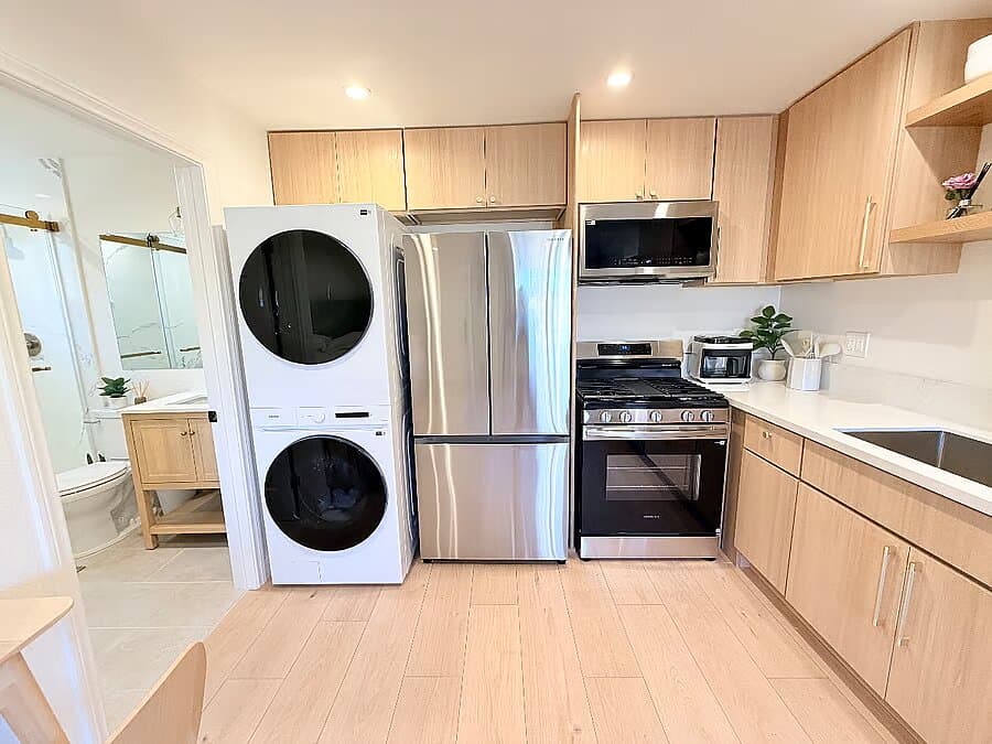 Open studio showing the king bed, sofa, dining table, and kitchen at the Anaheim ADU (photo 3)